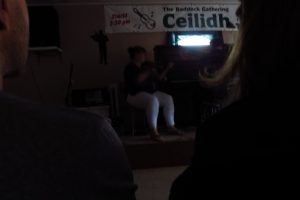 Playing in the dark at the Ceilidh Baddeck kitchen party, Baddeck, NS