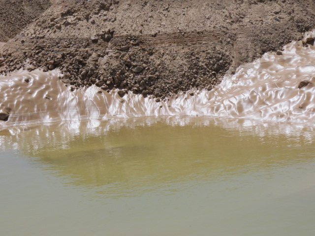Stunning effects of light in mud. Rain pool. Arava off road 12. Oct. 2014