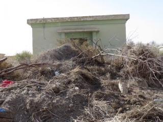 One more abandoned army building with dead vegetation. Kalya Beach