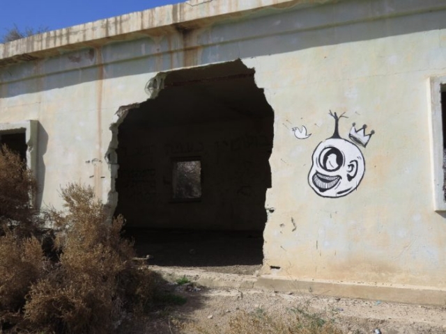 Old Jordanian army base with mural. Kalya Beach