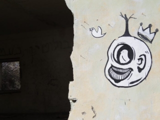 Old Jordanian army base with mural. Kalya Beach