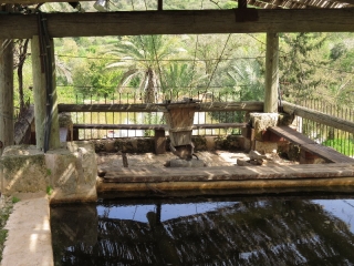 Grain shaker with grinding stone, and pond. Neot Kedumim