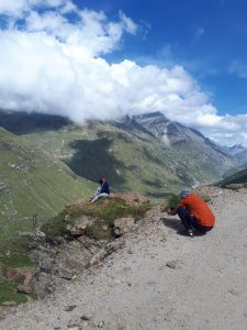 Admiring boyfriend takes pic of Indian beauty posing on rock on road from Manali to Leh Admiring boyfriend takes pic of Indian beauty posing on rock on road from Manali to Leh