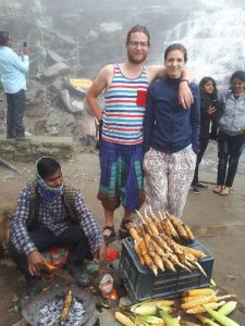 Bram and Nikki trying corn on the fire by a Himalayan waterfall , Himachal Pradesh Bram and Nikki trying corn on the fire by a Himalayan waterfall , Himachal Pradesh