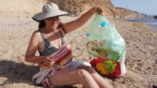 Collecting garbage from the beach. Apollonia Collecting garbage from the beach. Apollonia
