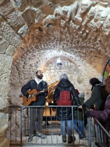 Singing for Hannuka down in Tzfat tunnels